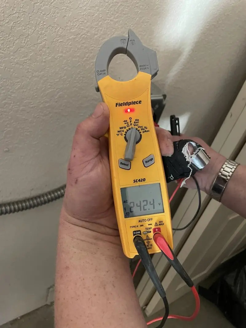 Voltage testing with clamp meter during Generator Installation in Treasure Island